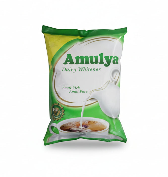 Amulya Dairy Whitener packaging with a green and white design.