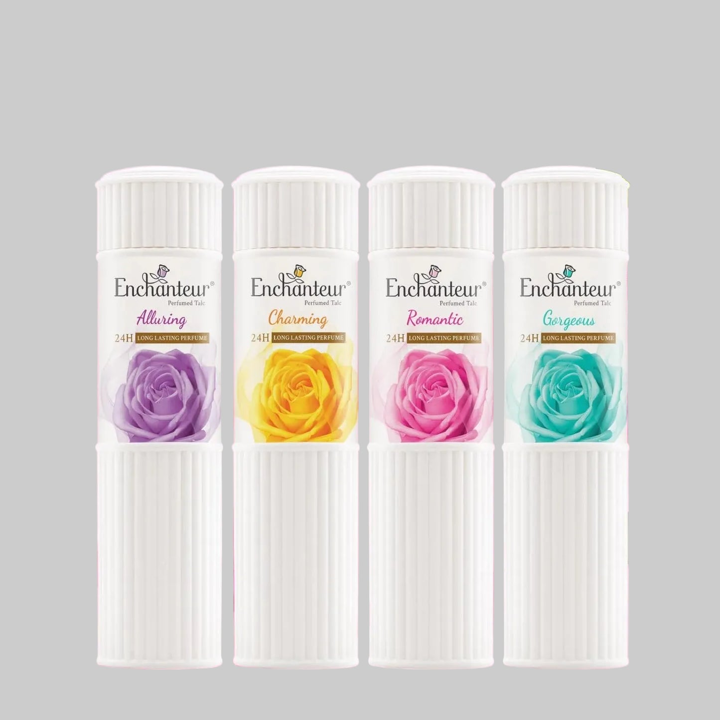 Four Enchanteur perfume bottles with floral designs on a pink background with flowers and petals.