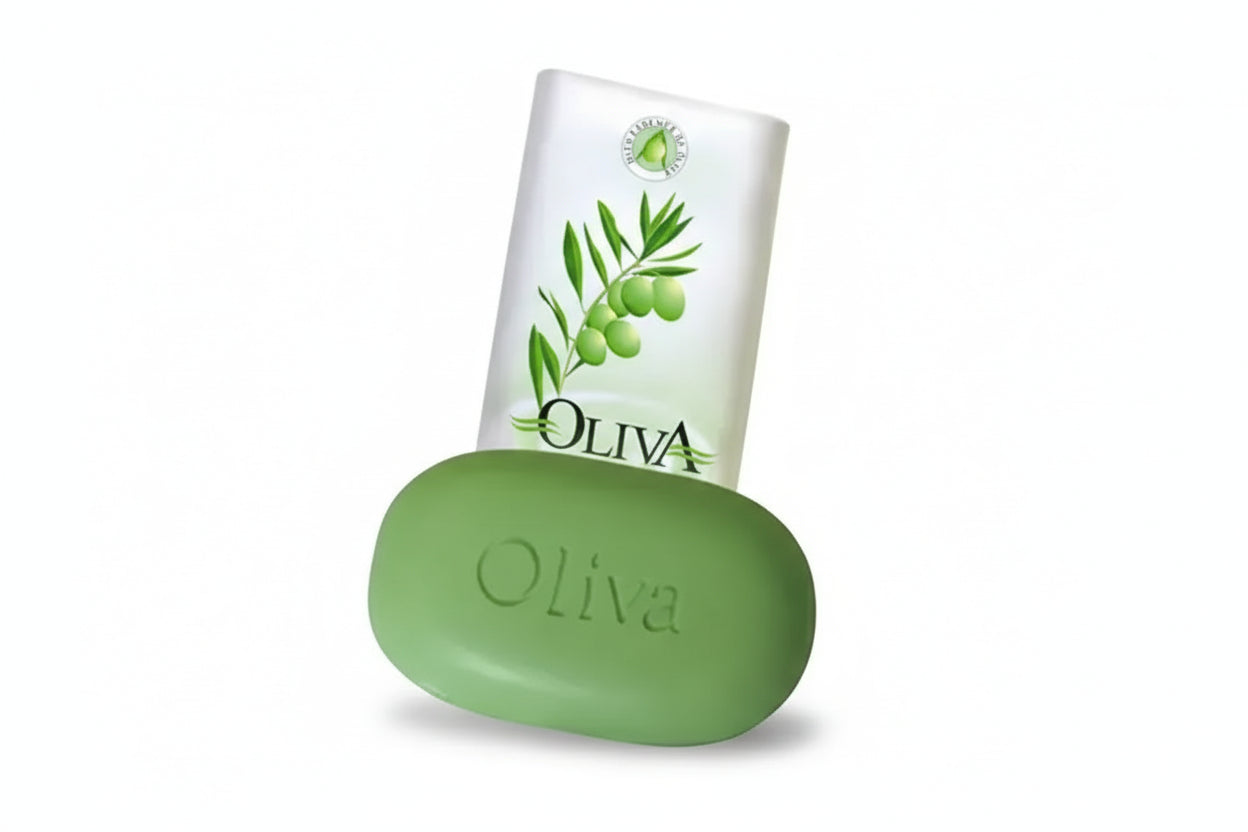 Green olive soap bar and bottle with 'Oliva' branding on a white background