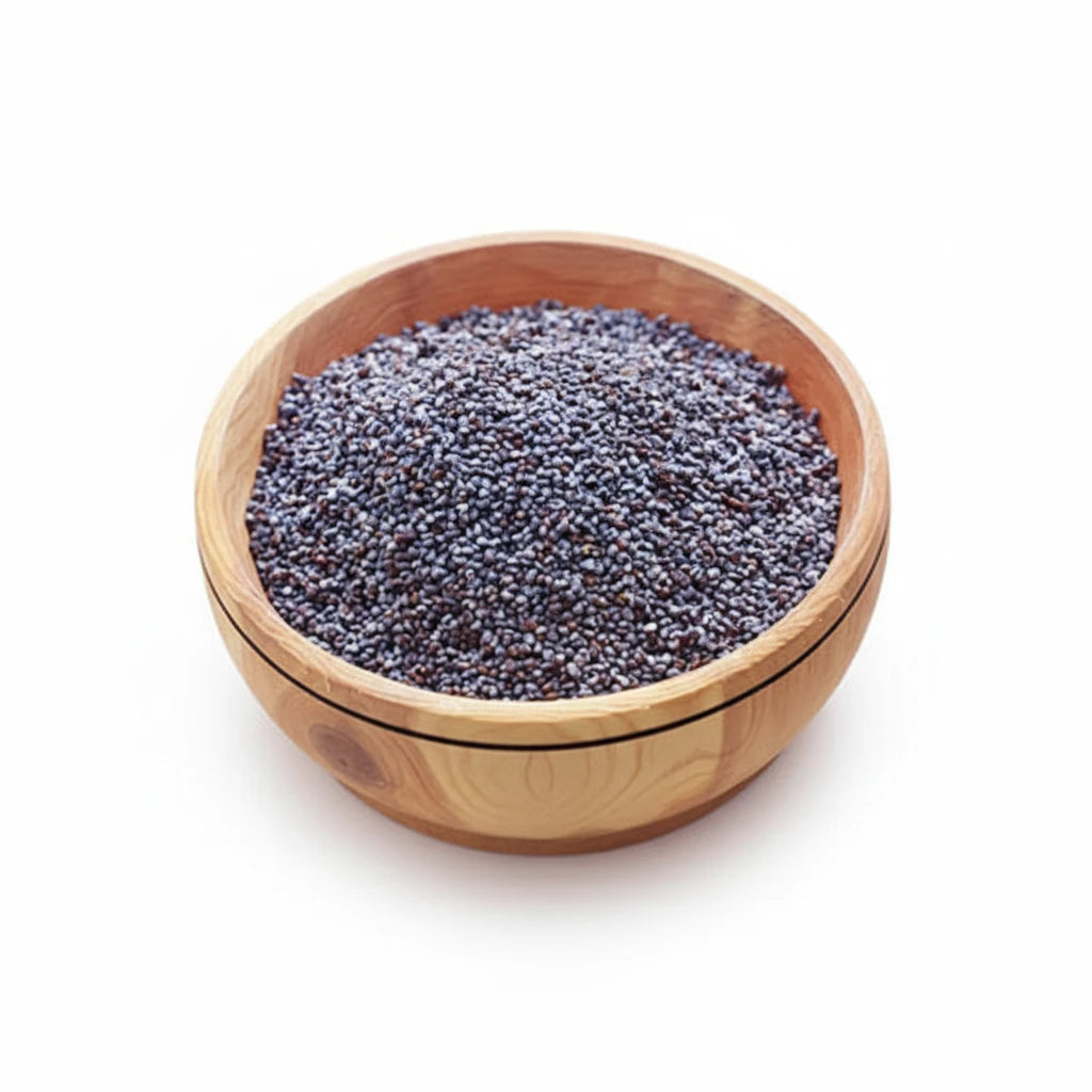 Wooden bowl filled with purple seeds on a light wooden surface