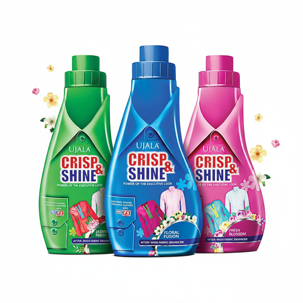 Three bottles of Ujala Crisp & Shine fabric softener in green, blue, and pink on a light gray background.