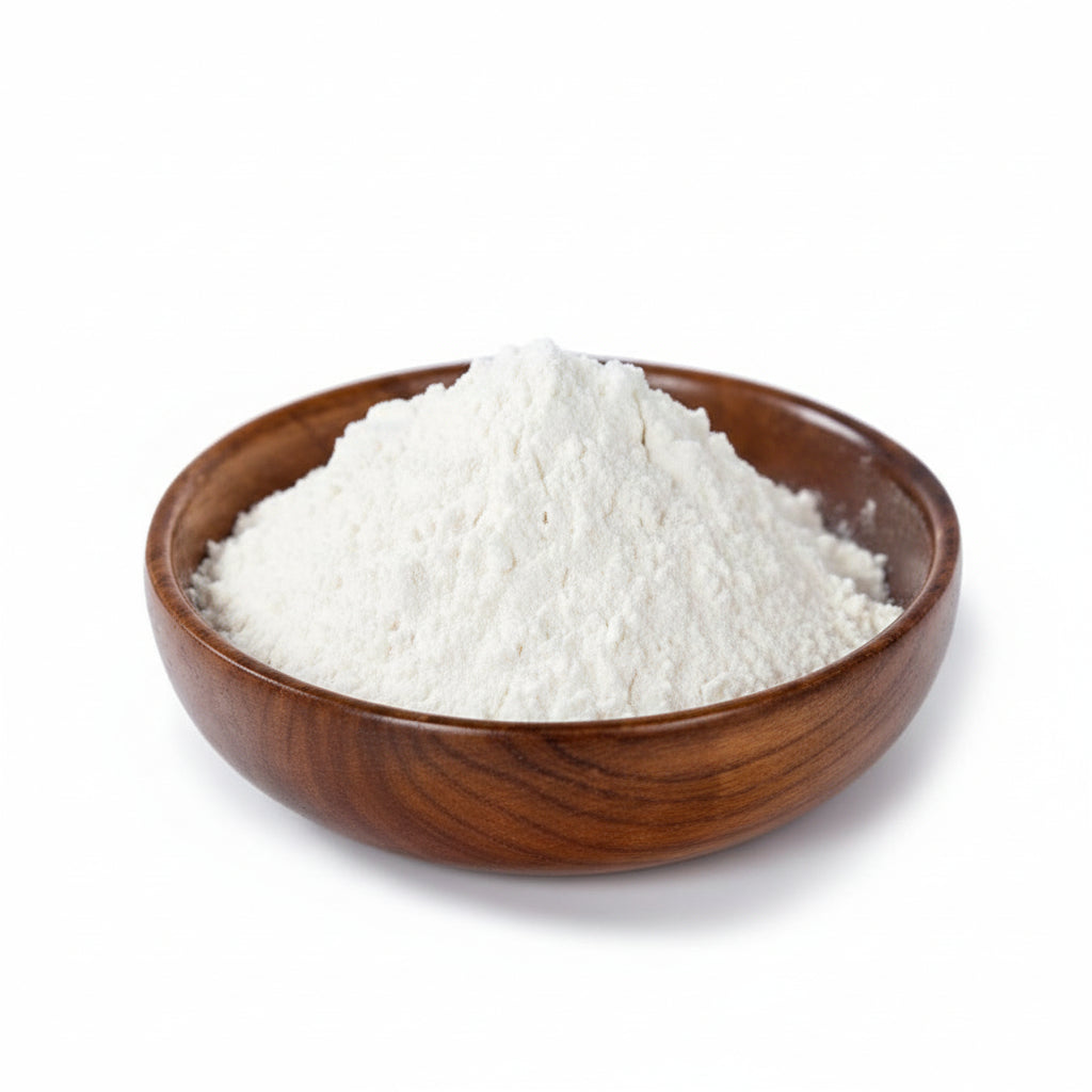 Wooden bowl filled with white powder on a light gray background