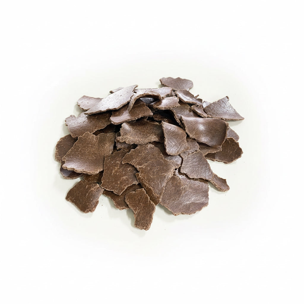 Close-up of chocolate shavings on a white background