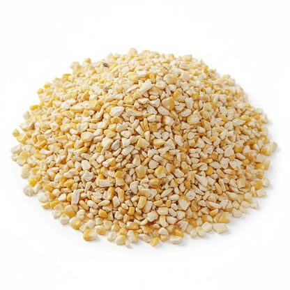 Close-up of a mound of yellow and white crushed cereal on a white background