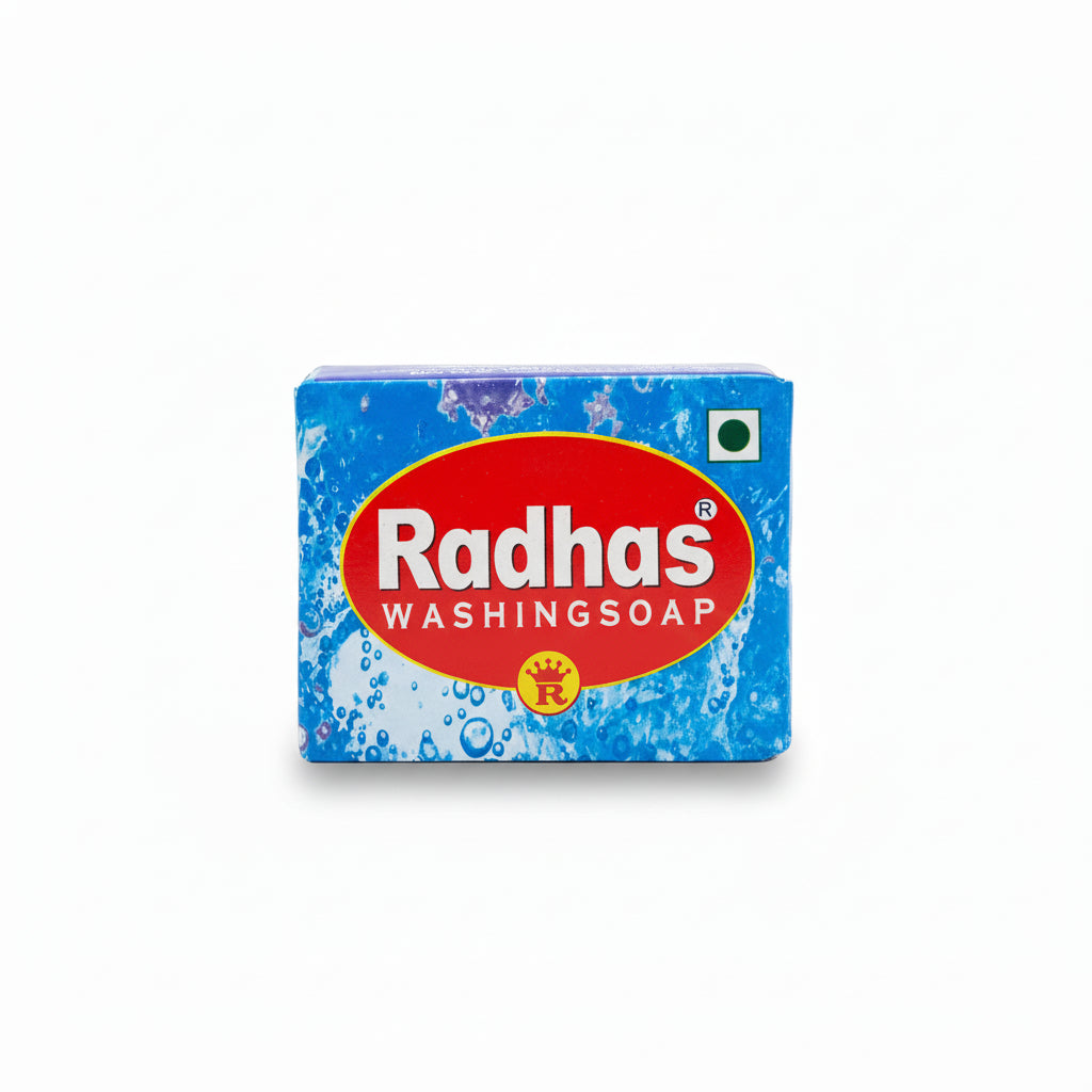Bar of Radhas washing soap with blue packaging and red label on a gray background
